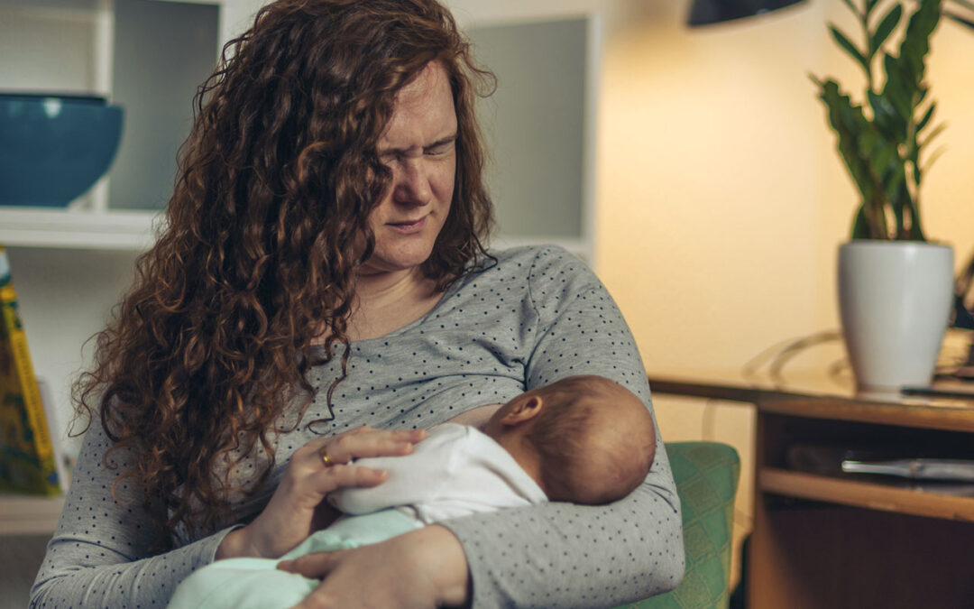 Painful latch during breastfeeding.